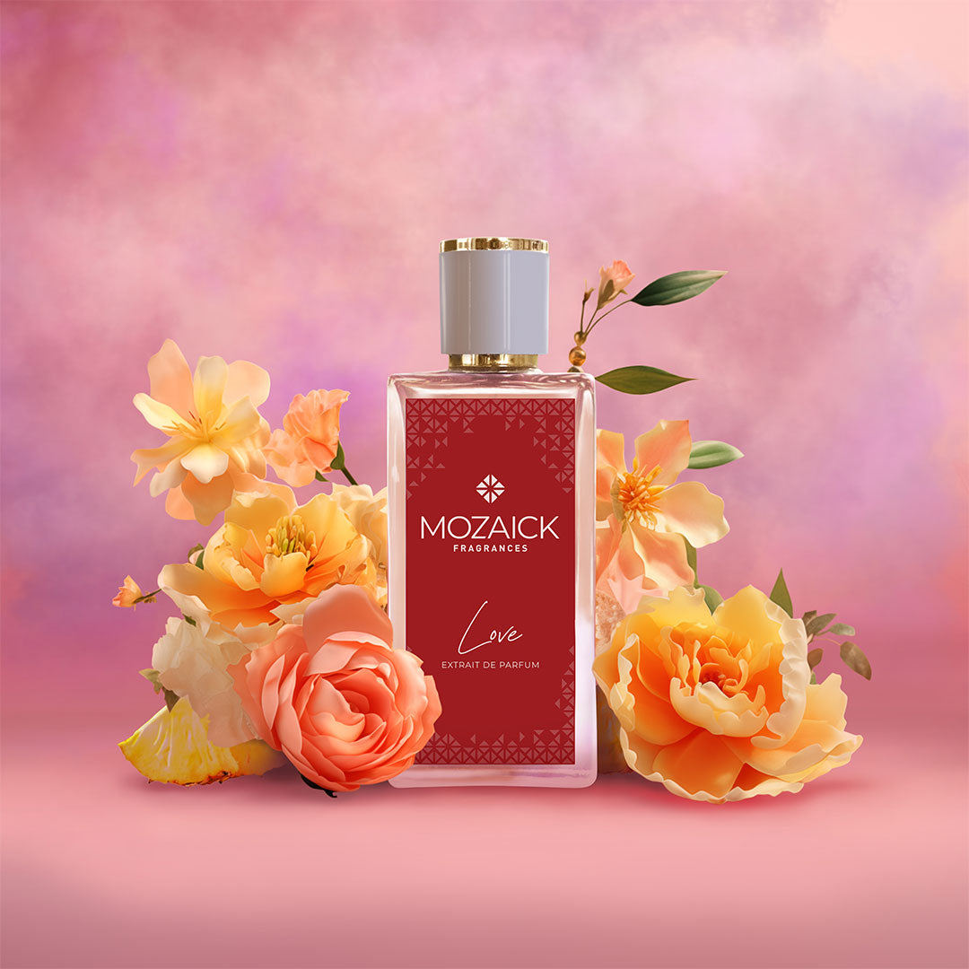 LOVE Extrait de Parfum 50 ml by MOZAICK – bottle with peach and orange roses on a pink background